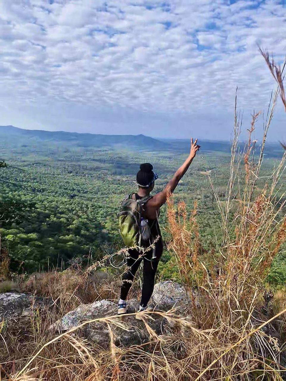 A person hiking with a view of mountains